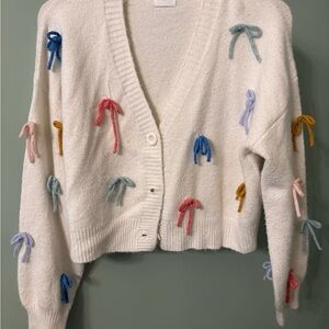 Charming White Cardigan with Colorful Bow Details